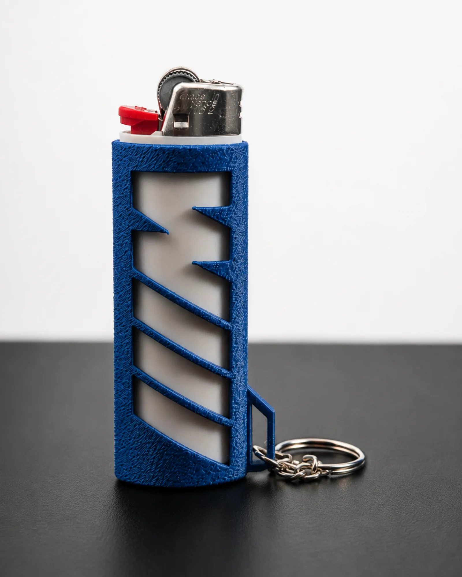 Blue BMW M-style lighter case standing upright