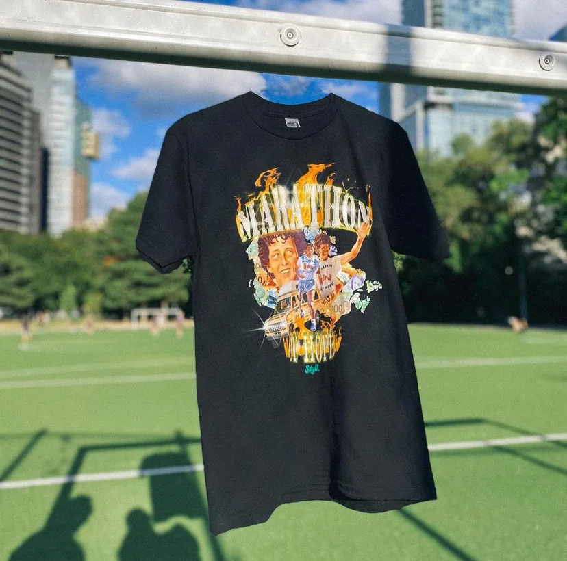 Styll tee hanging on field fence